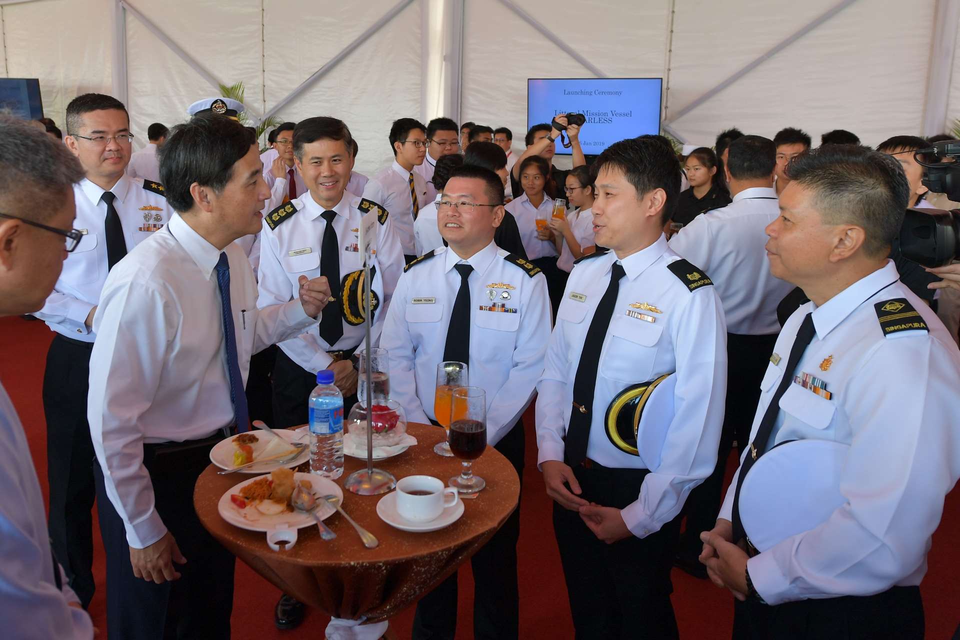 Mr Heng (second from left) interacting with former crew from the Patrol Vessel RSS Fearless.