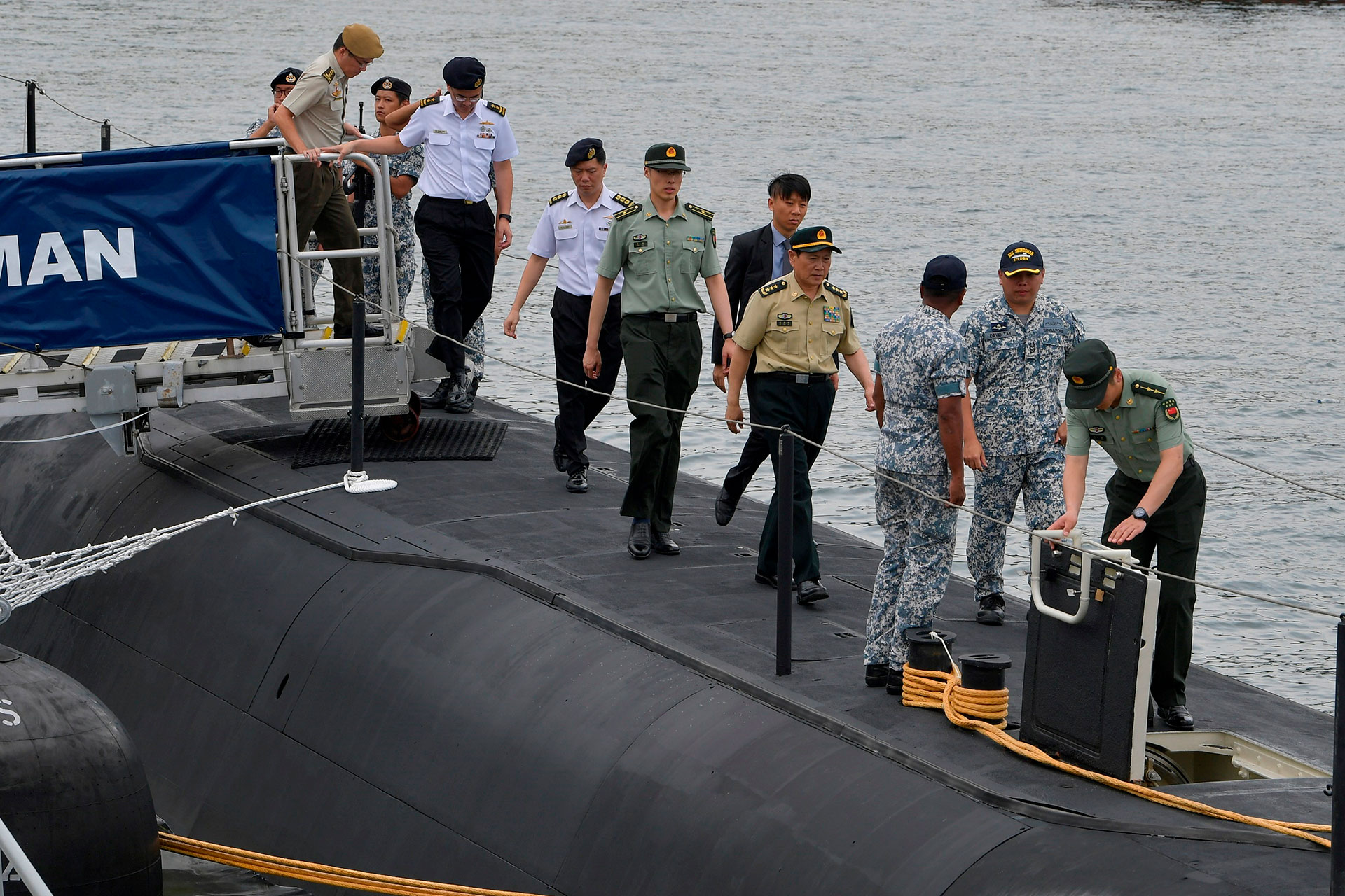 GEN Wei embarking the Archer-class submarine, RSS Swordsman, during his visit to RSS Singapura - Changi Naval Base.