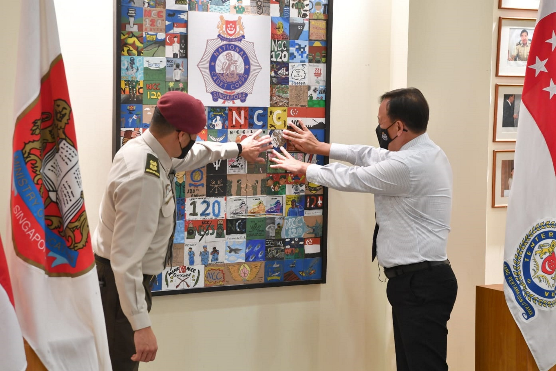 Chairman NCC Council Brigadier-General (NS) Chan Wing Kai (right) laying the final tiles of the Inspiration Mural designed by various NCC units at Amoy Quee Camp for the NCC's 120th Anniversary.