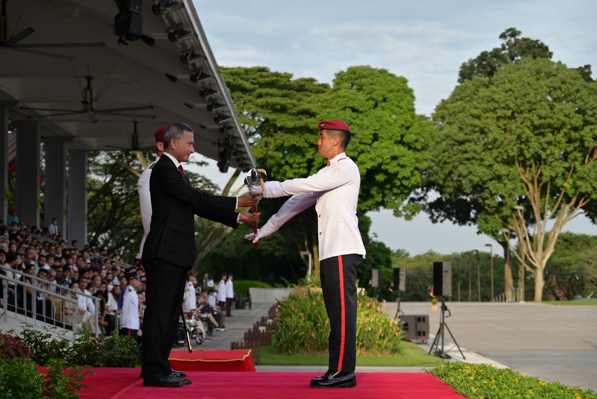 Dr Balakrishnan presenting the Sword of Honour to an Officer Cadet from the Singapore Army.