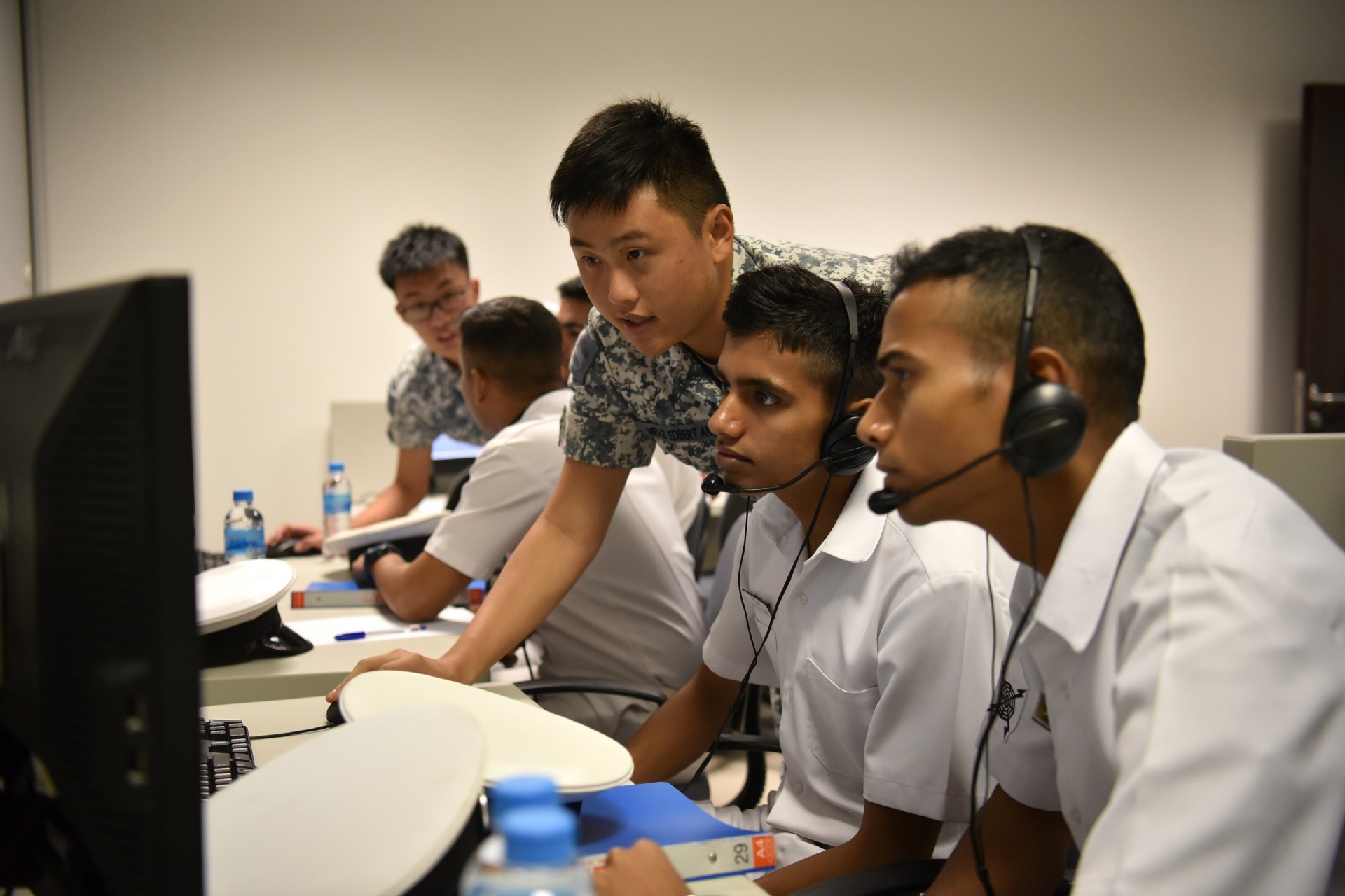 RSN personnel working alongside their IN counterparts at the Naval Tactical Trainer in Changi Naval Base.