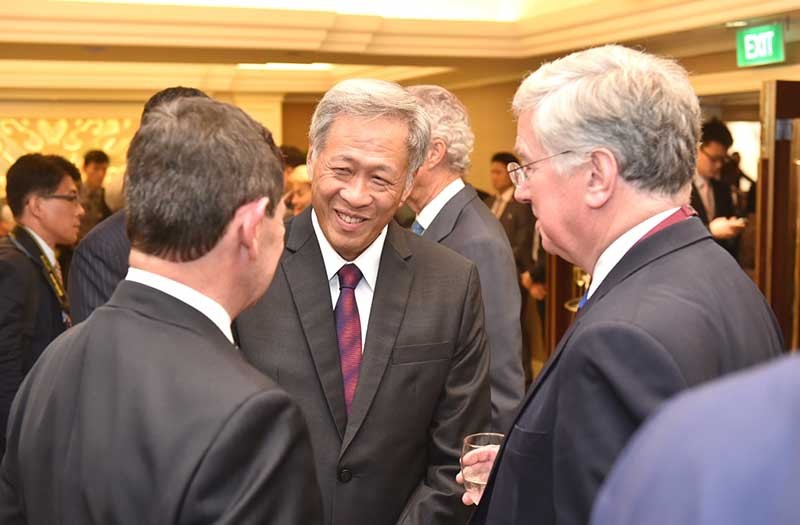 Minister for Defence Dr Ng Eng Hen speaking with Australia Minister for Defence Kevin Andrews (left) and United Kingdom Secretary of State for Defence Michael Fallon at the Opening Reception of the 14th Shangri-La Dialogue on 29 May 2015.