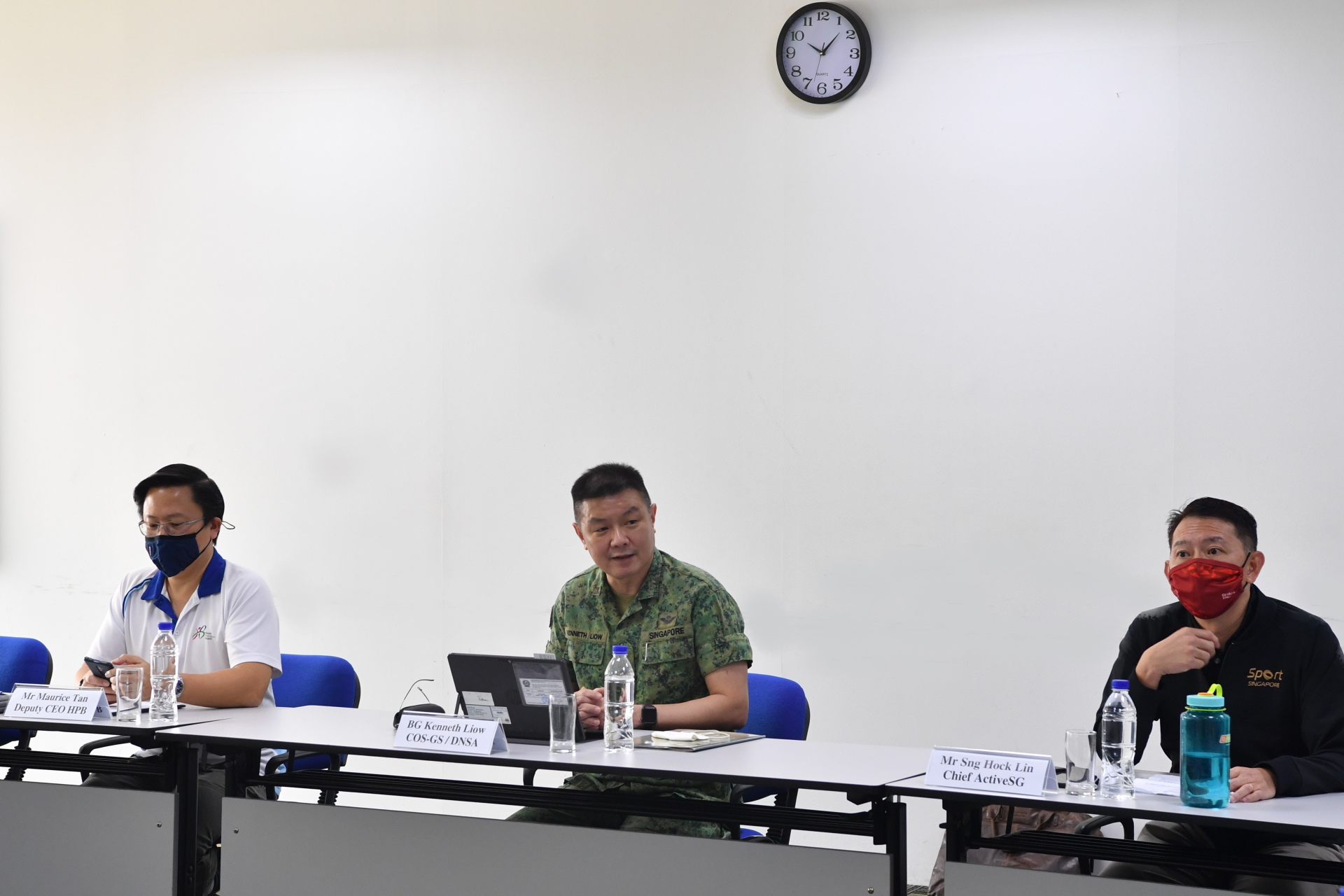 Chief of Staff – General Staff / Director National Service Affairs, Brigadier-General (BG) Kenneth Liow briefing the media on the National Service Fitness Improvement Training (NS FIT) with Deputy Chief Executive Officer, Health Promotion Board (HPB), Mr Maurice Tan (right) and Chief ActiveSG Mr Sng Hock Lin (left).