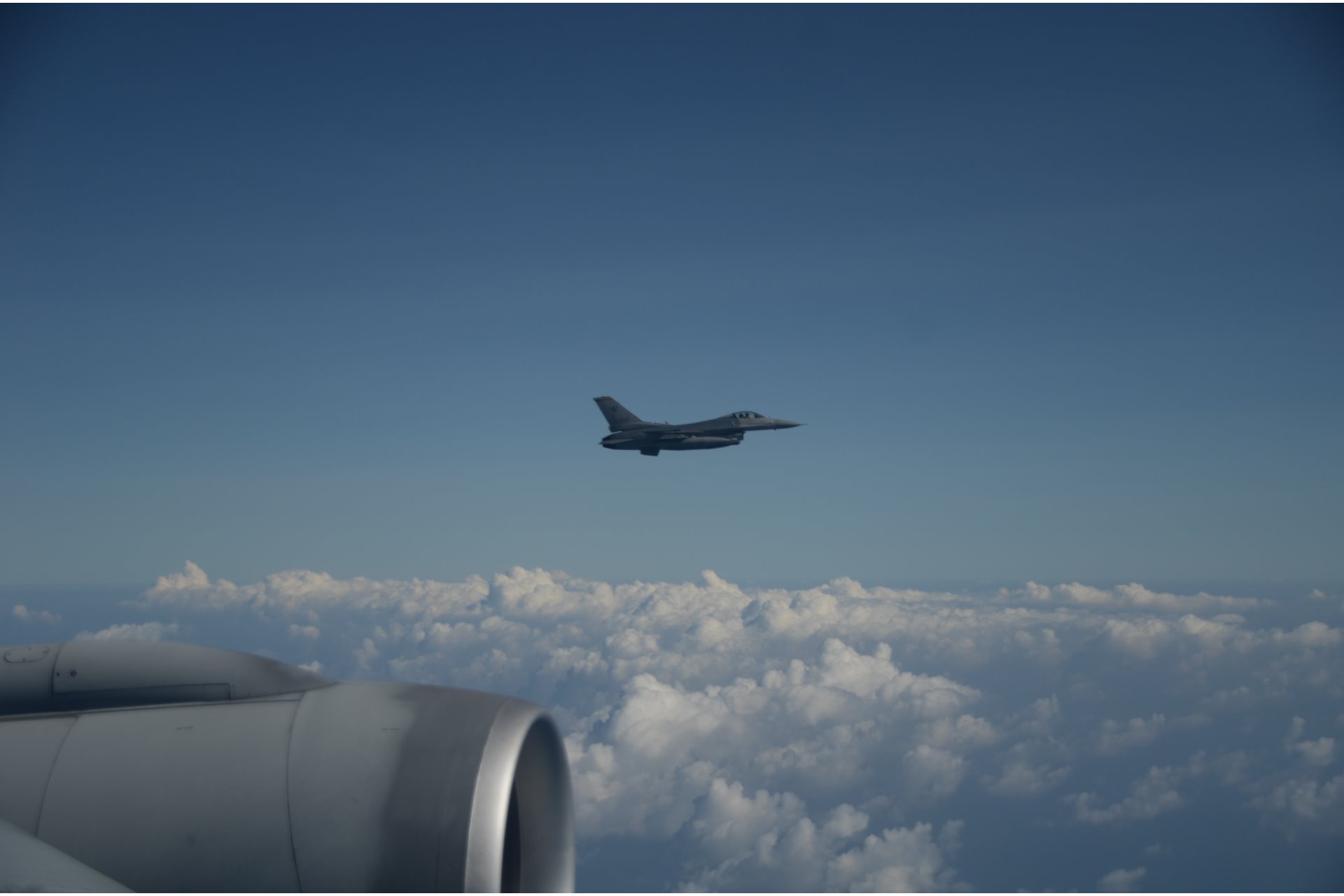 An RSAF F-16C fighter aircraft intercepting a simulated suspicious aircraft at the air defence exercise.