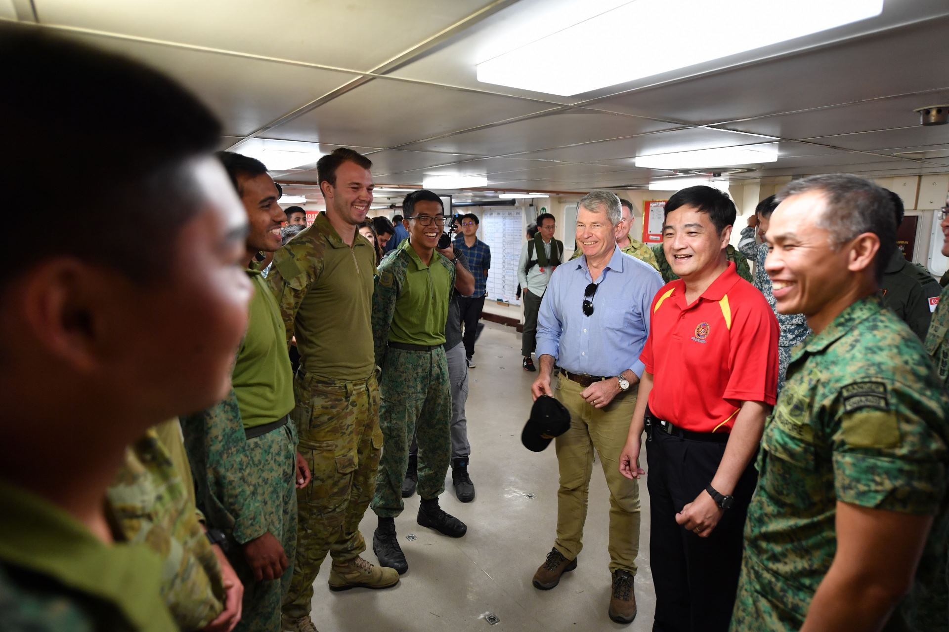 Mr Heng and Mr Fawcett interacting with the exercise participants from the SAF and ADF.