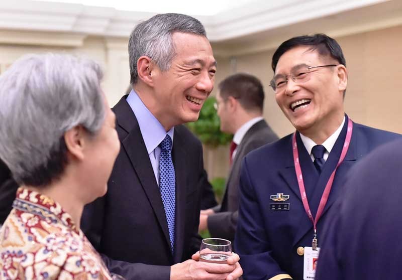 Prime Minister (PM) Lee Hsien Loong, the keynote speaker, with People's Liberation Army Deputy Chief of General Staff Admiral Sun Jianguo at the Opening Reception of the 14th Shangri-La Dialogue.