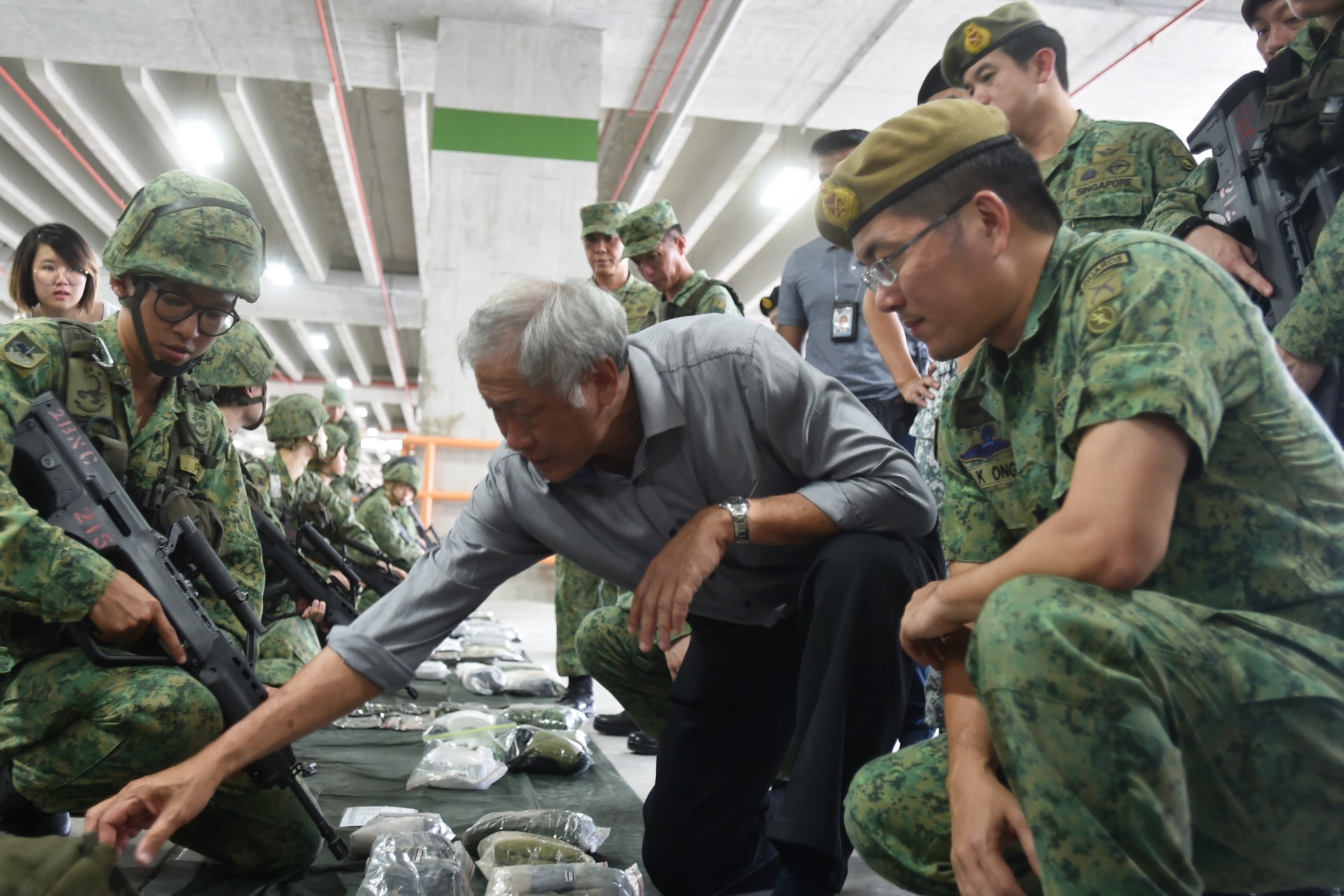 Minister for Defence Dr Ng Eng Hen observing the field pack inspection at the mobilisation and equipping exercise in Selarang Camp.