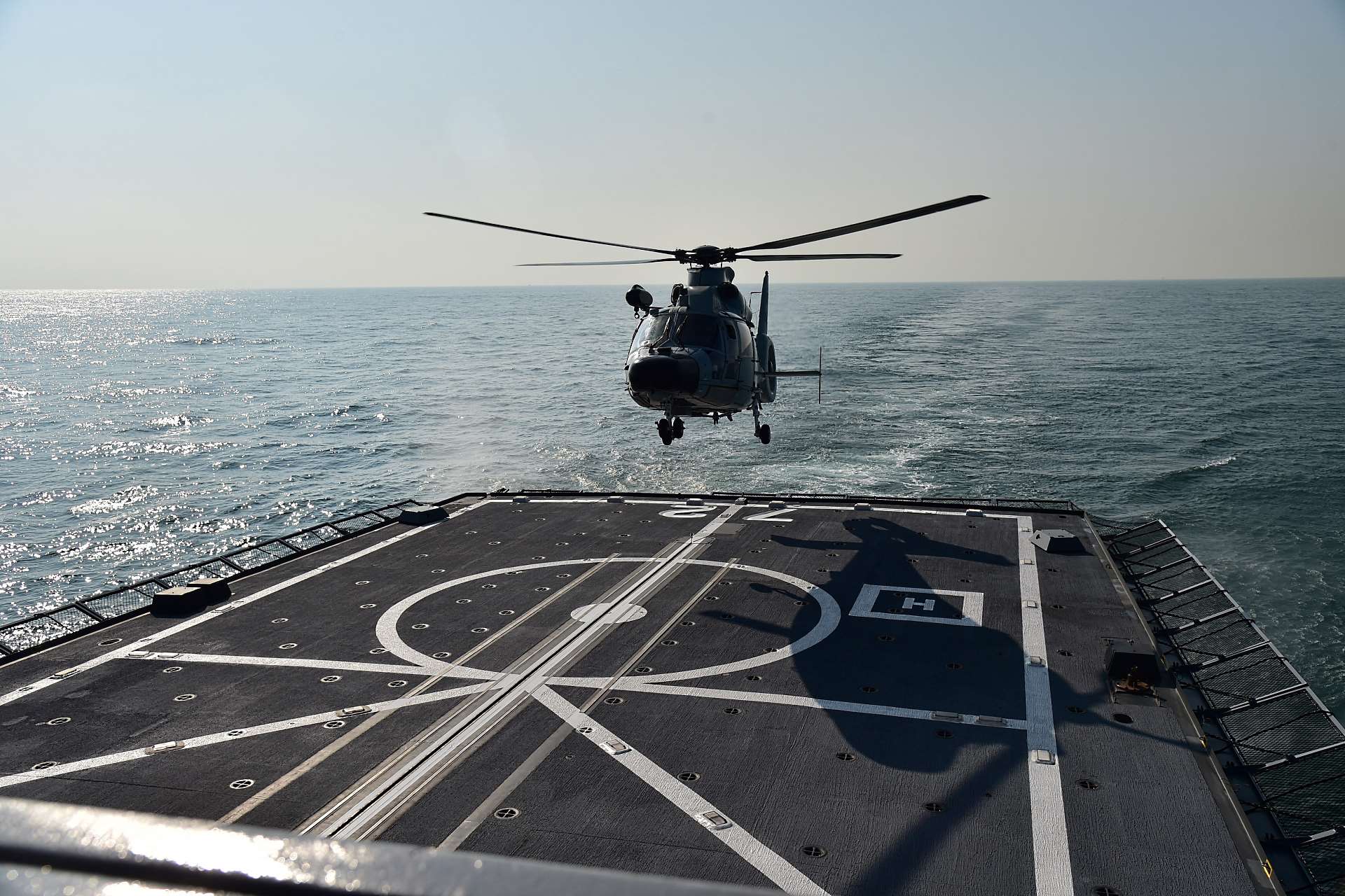 PLAN Harbin Z-9 helicopter landing on the helicopter deck of RSS Stalwart during the helicopter cross-deck landing drill.