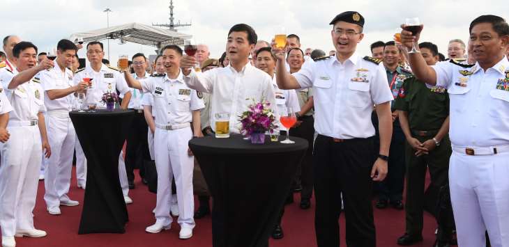 Senior Minister of State for Defence Mr Heng Chee How and navy chiefs giving a toast at the international warship cocktail reception on board the Republic of Singapore Navy’s Endurance-class Landing Ship Tank RSS Persistence.
