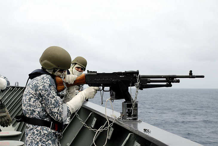 2 Navy soldiers training on ship