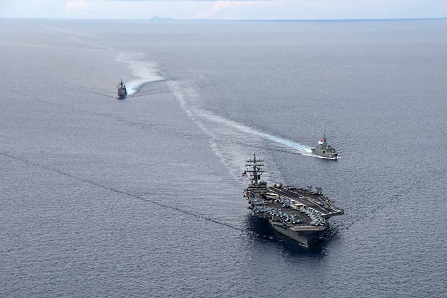 USS Ronald Reagan (bottom) sailing in company with the RSS Intrepid (middle) and USS Shiloh (top) during a manoeuvring exercise.
