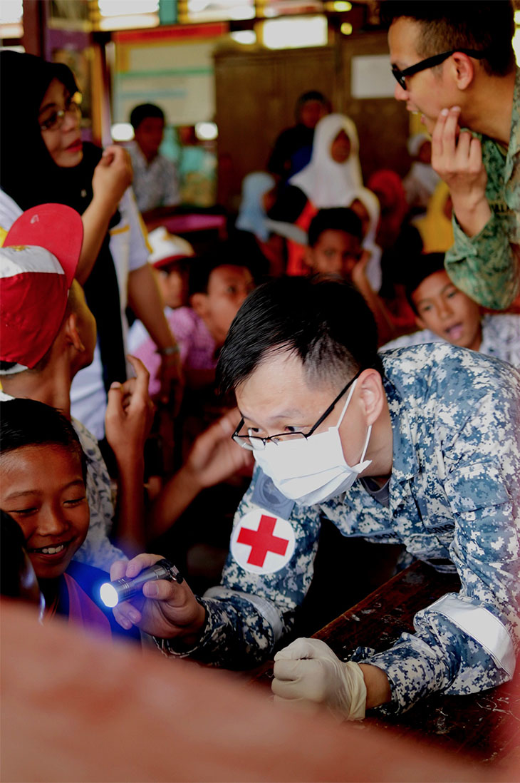 Red Cross Navy Doctor in operation