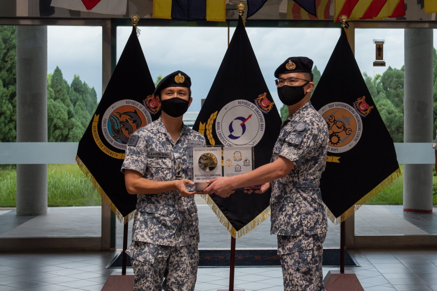 Receiving the Best Naval Engineering and Logistics Unit Award from CNV RADM Aaron Beng (left).