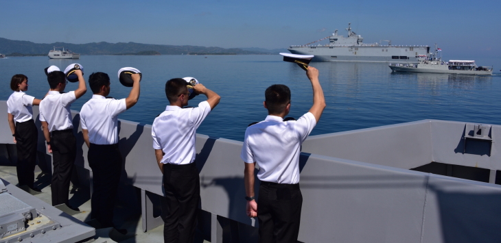 Crew from RSS Formidable lining up on deck as Indonesian Navy (TNI AL) Chief of Staff Admiral Ade Supandi conducts the International Fleet Review on board KRI Barakuda (first from right).