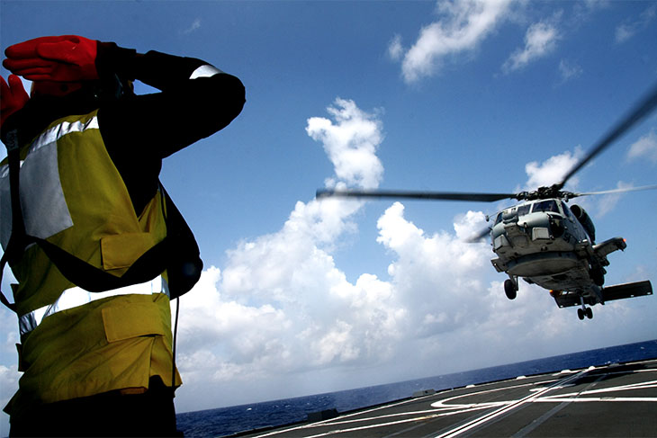 Seahawk helicopter landing on one of the Singapore frigate