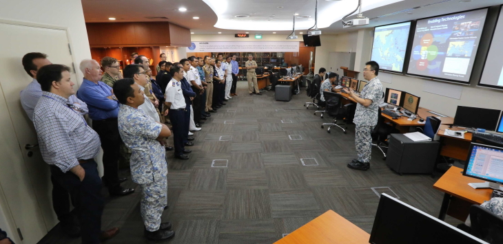 Exercise SEACAT participants receiving a brief on the newly enhanced information sharing portal at Republic of Singapore Navy (RSN)