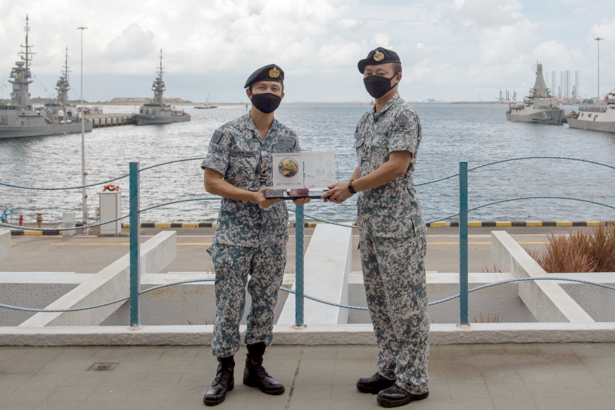 Receiving the RSN Best Fleet Unit from CNV RADM Aaron Beng on SAF Day.