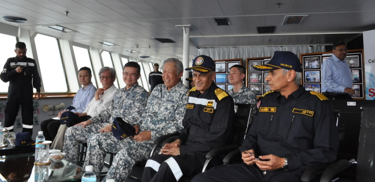 Minister for Defence Dr Ng Eng Hen being briefed on the combined missile firing by the Republic of Singapore Navy and Indian Navy on board IN