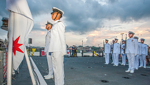Navy recruits at sunset ceremony