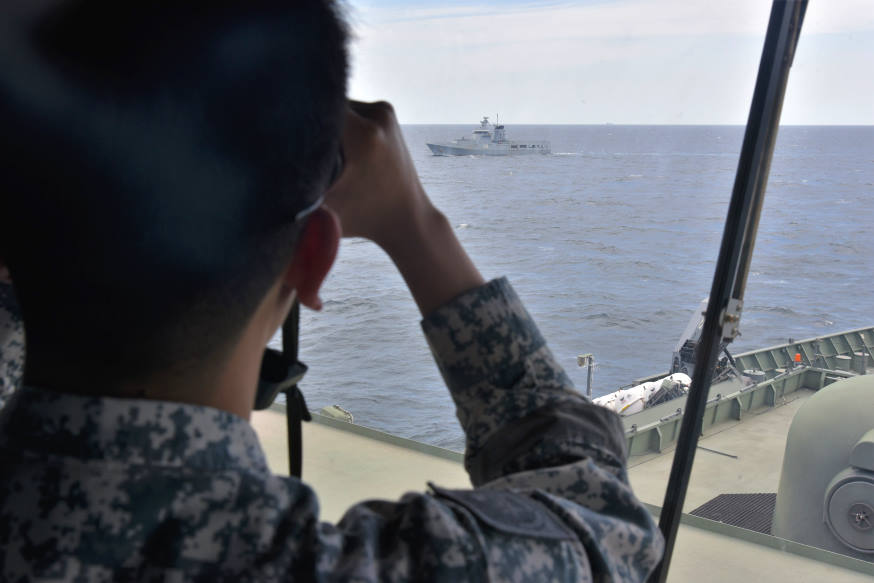 The Officer-of-the-Watch on board RSS Endeavour monitoring KDB Daruttaqwa during the manoeuvring exercise (MANEX) serial.