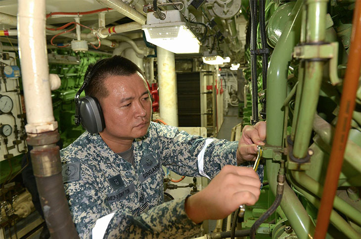 Singaporean Navy doing maintenance aboard ship