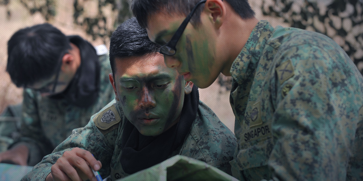 Servicemen planning during an exercise