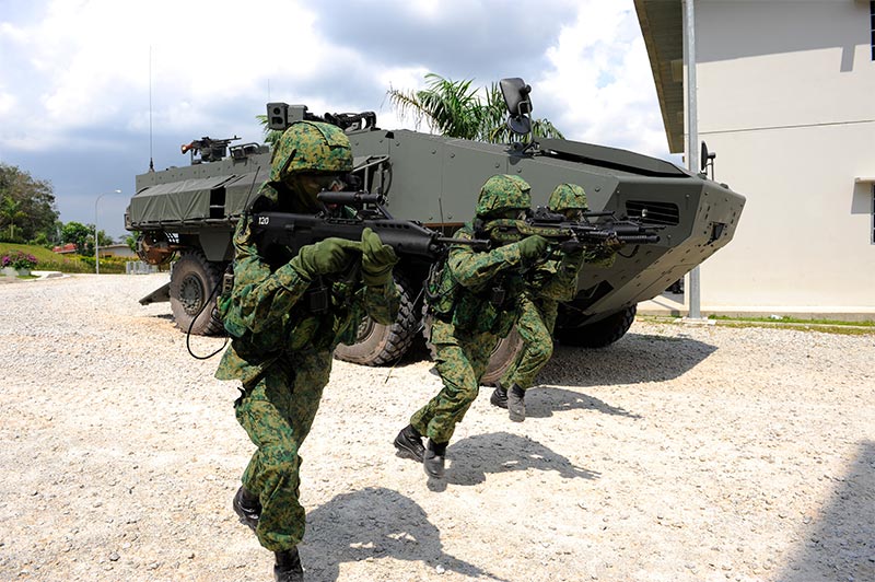NSmen participating in an exercise with a Terrex ICV