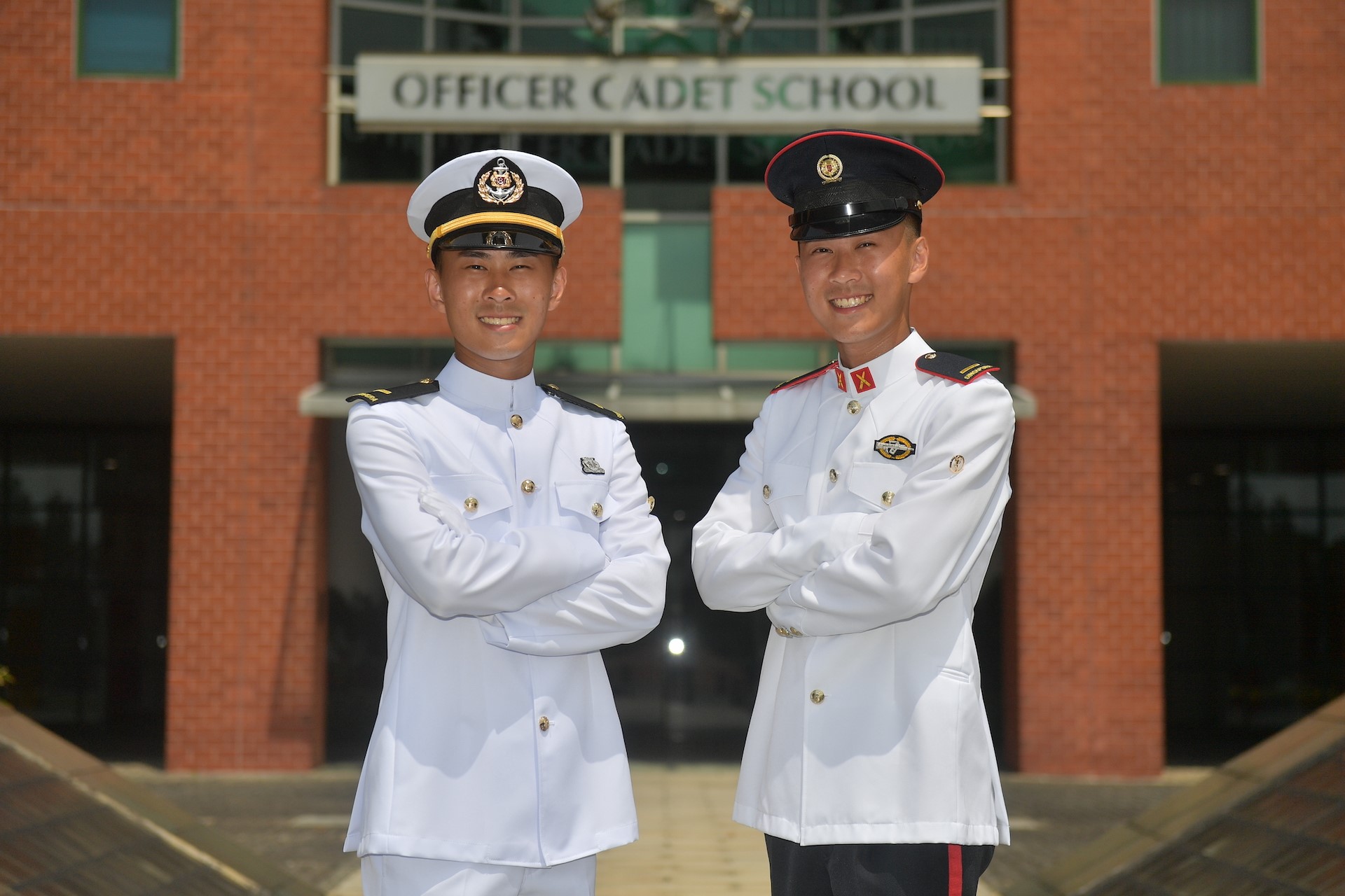 Twins commissioned among 417 cadets in first full OCS parade since COVID-19